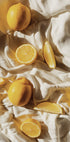 Vibrant Lemons on Textured Fabric Plakat - Posterbox.dk